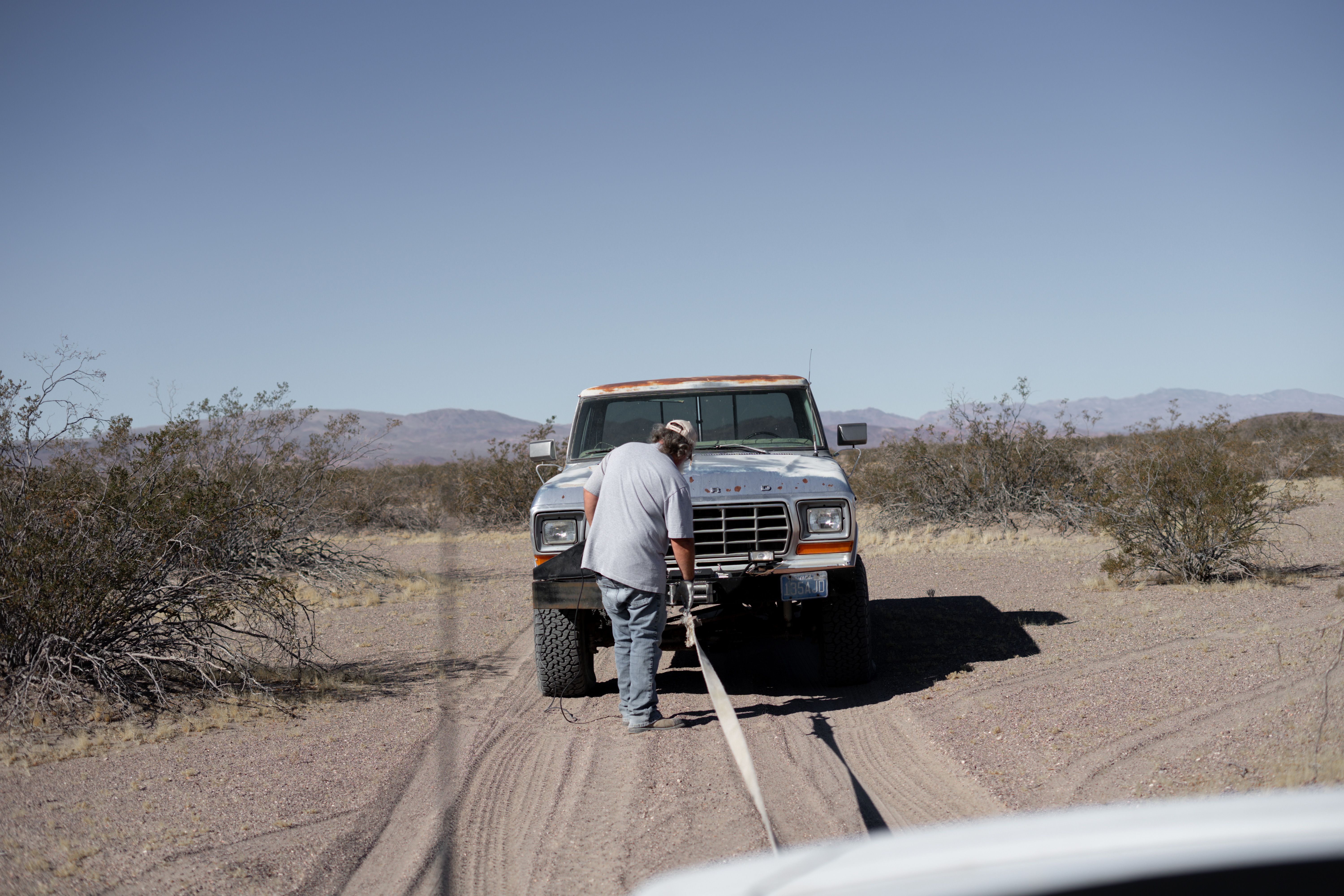 Roadside assistance technician helping driver